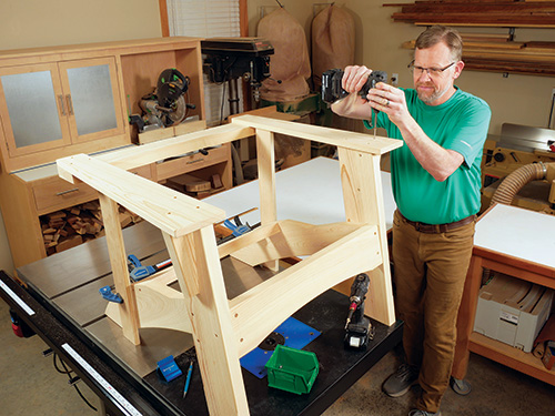 Attaching arms to rocking chair frame