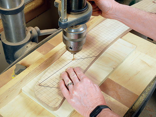 Drilling holes in the corner of the template