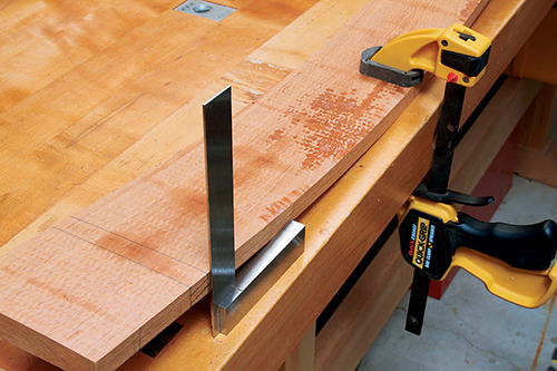 Clamping tablefront panel to work surface to check the curvature