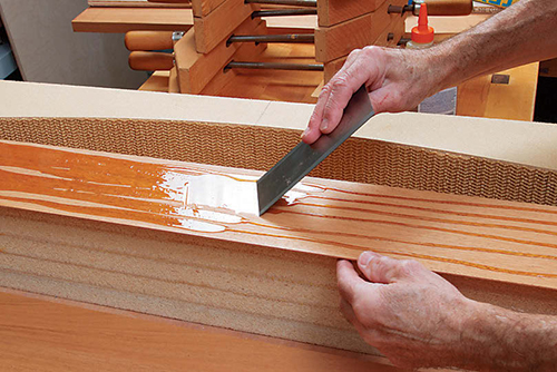 Layering wood during lamination process