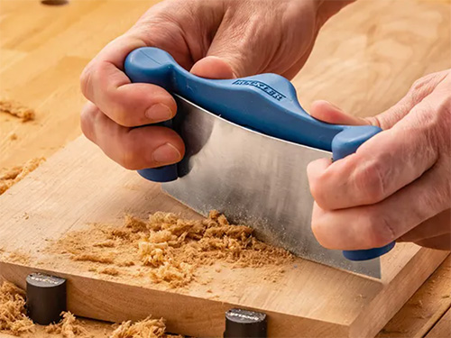 Flattening a board with a cabinet scraper