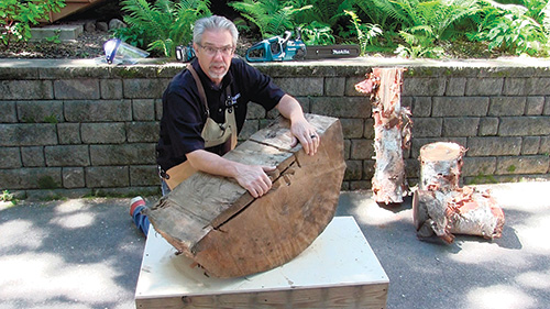 Rob Johnstone displaying the cottonwood for his table