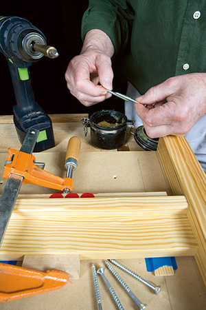 Coating screws in beeswax for driving into compact bench parts