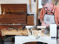 Ernie Conover creating a turning project on a lathe