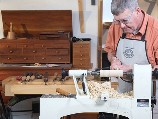 Ernie Conover creating a turning project on a lathe