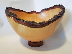 Turned bowl with natural rim