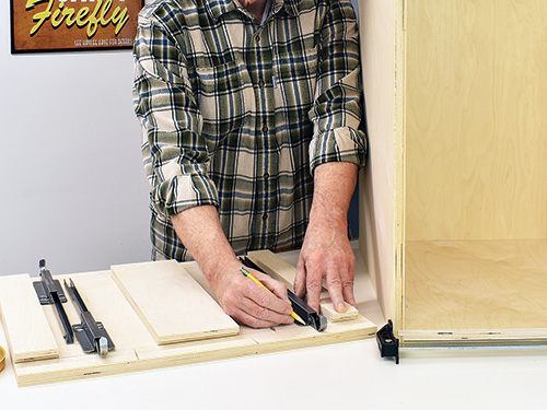 Marking drawer installation points on drill press cabinet