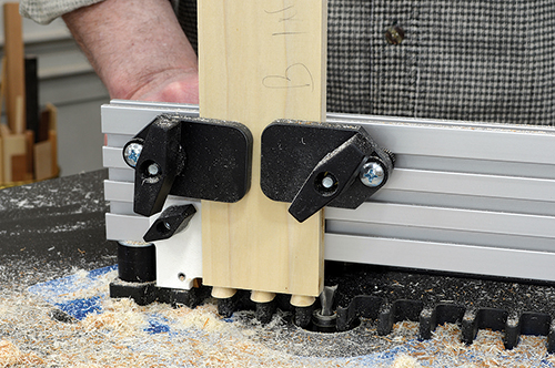 A router table dovetail jig makes fast work of the half-blind drawer dovetails. Although not visible, the drawer front is cut at the same time.