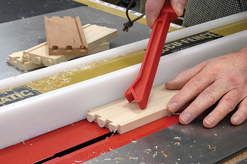 Cut the grooves for the drawer bottoms so they fall within the bottom tail. Once assembled, the groove will be invisible.