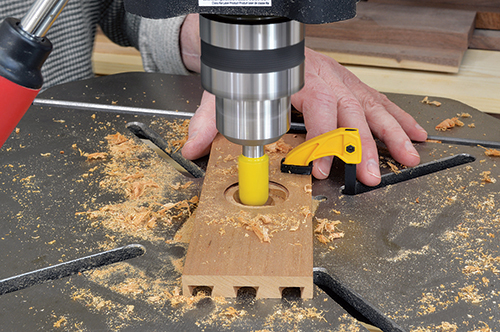 Finish the drawer front mortise by rounding out the bottom to accept the rounded back of the flush pull.