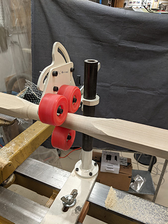 A metal tool rest designed for attachment to a lathe