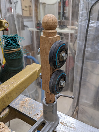 Homemade tool rest made with roller skate wheels