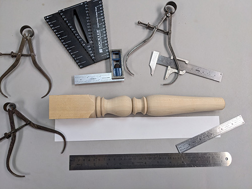 Example of calipers and other tools used to replicate a stool leg