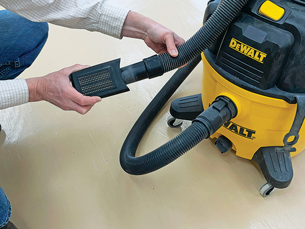 Cleaning out sander's dust collection tray