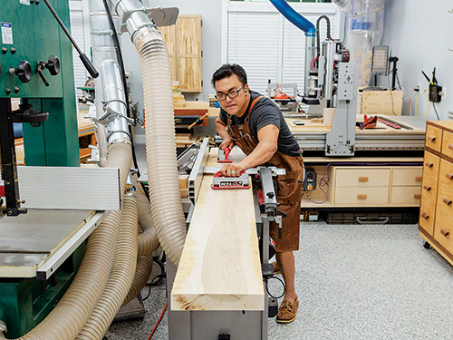 Smoothing dining table tabletop on planer