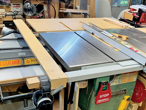 Making adjustment to close table saw cutting support system