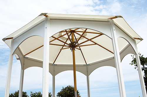 Assembled gazebo with umbrella center