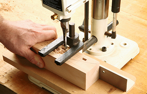 Cut mortises with mortising machine