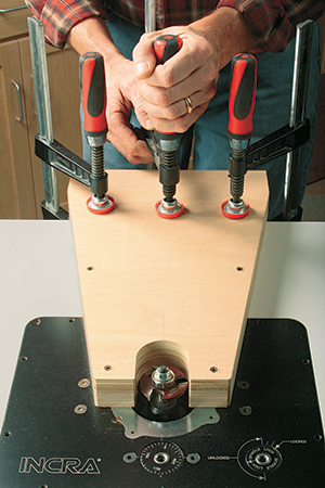 The author used a coved panel-raising bit with its top cutter removed to introduce depth and shadow lines into the bed’s large center panels.