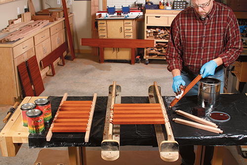 A blend of two General Finishes water-based dye stain colors produce this warm brown tone. After you’ve raised the grain with water and sanded it smooth again, flood stain onto the bare wood, and wipe off the excess.