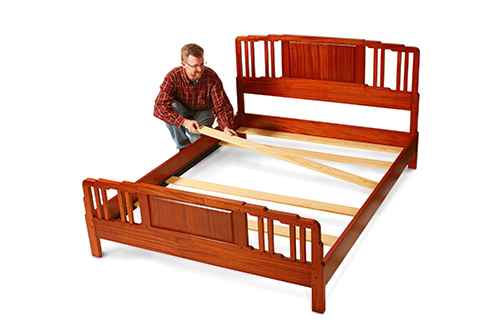 Tap the bed rail hardware together with a deadblow mallet, and add six cross supports to assemble this sturdy frame.