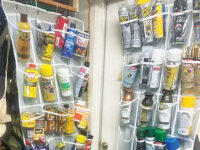Using hanging plastic shoe holders to store finishing supplies