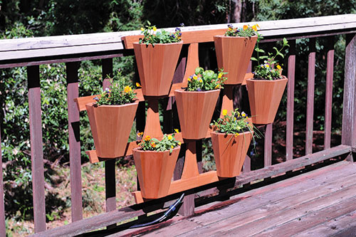 Planter system on frame attached to decking