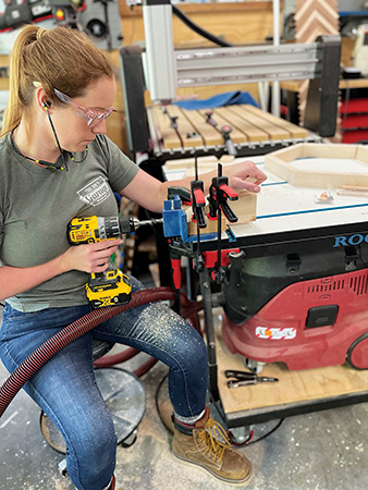 Using jig to cut mortises in table hexagon pieces