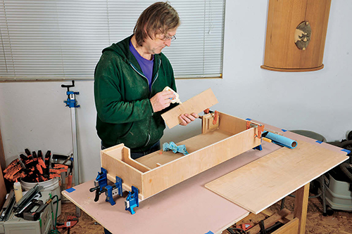 The coffee table's drawer box is made mostly from 1/2” cherry plywood parts that are glued and nailed together.