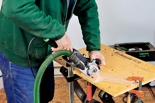 Festool's Domino joinery machine cuts mortises in the legs.