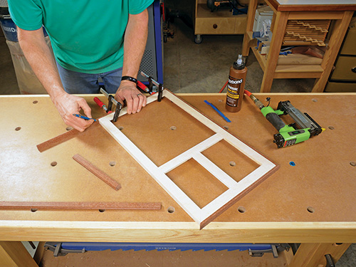 Clamping moldings in place on frame