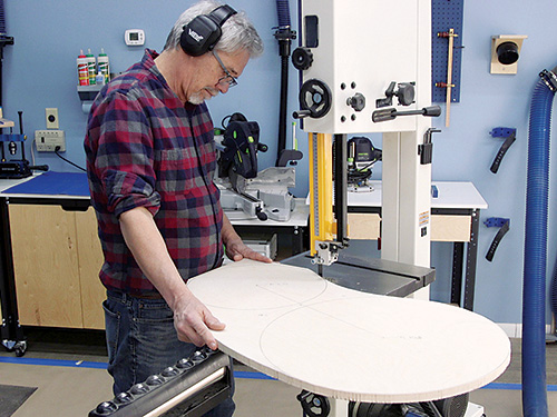 Trimming kidney table base with band saw