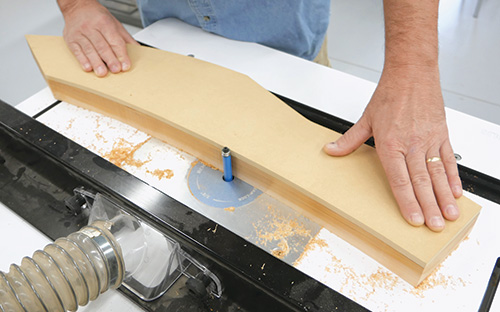 Cutting modern adirondack chair pieces with a template and a router