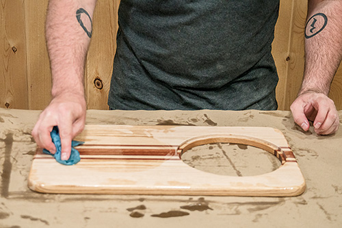 Applying mineral oil finish to over the sink cutting board