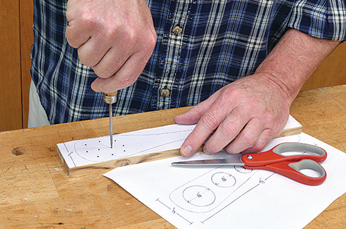 Marking drilling holes with paper template guide