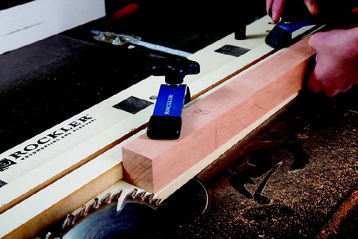 Using scrap lumber sized identically to match the table legs, the author tests the jig's setup.