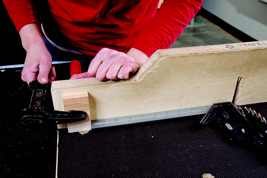 Set up a stop block on a crosscut sled.