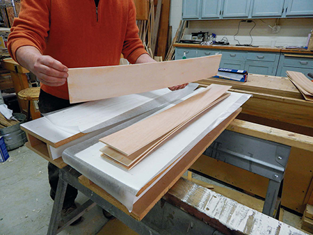 Glue up laminations for the cabinet's sides. Use four layers here to accommodate more substantial rabbets for gluing the cabinet together.