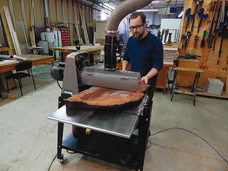 Sand off the excess epoxy after it has fully cured, using a drum or belt sander. A SuperMax 19-38 open-ended drum sander easily makes a perfectly flat surface. Finish up with a random orbit sander or by hand-sanding.