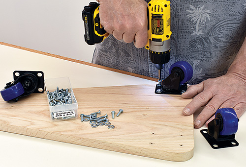 Installing casters on task light baseplate