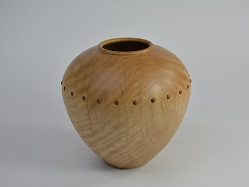 Turned vase with raised inserts from router cut holes