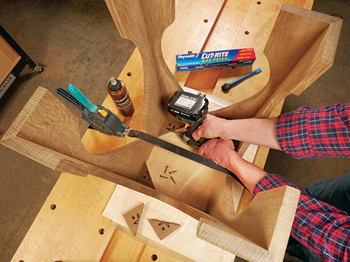 Screwing glue blocks in place inside taboret table