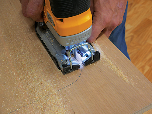 Cutting foot installation holes in panel with jigsaw