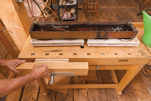 Marking chair back curve on panel in workbench vice