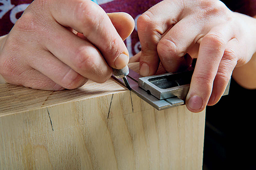 Draw the tail shapes carefully onto the seat. Use a square to transfer layout lines around its thickness. Accuracy is critical to a good fit here.