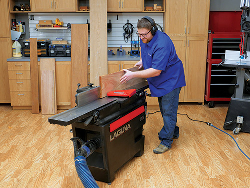 Running lumber through jointer