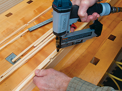 Securing lattice pieces in place using pin nailer