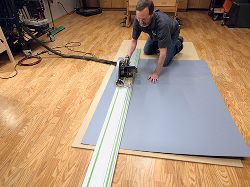 Cutting plastic laminate sheet with track saw