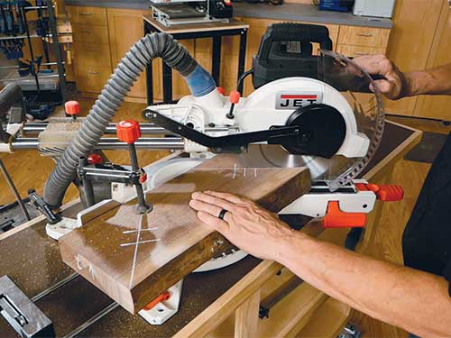 Cutting miters in walnut lumber with miter saw