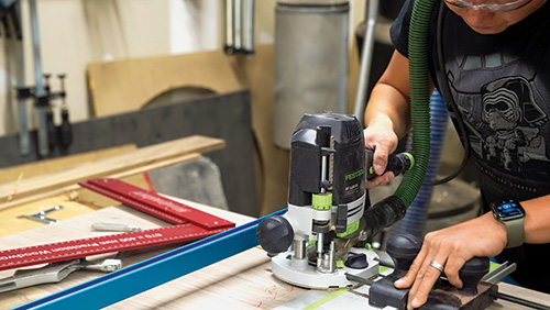 Cutting dados in walnut cabinet base panel